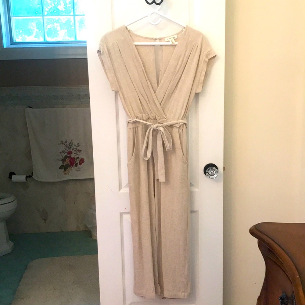 Women’s onesie size small. Beige